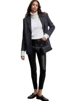 Pantalon noir uni avec une coupe skinny et un zip sur le côté