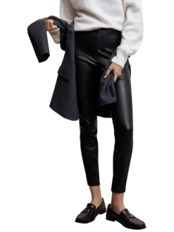 Pantalon noir uni avec une coupe skinny et un zip sur le côté