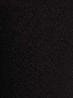 Pantalon noir uni avec une coupe slim et une taille intermédiaire