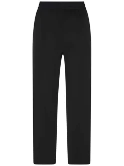 Pantalon noir uni pourvu d'une coupe large et d'une taille élastiquée