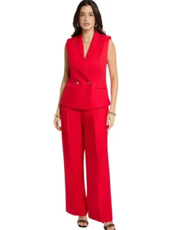 Pantalon rouge uni pourvu d'une coupe large et de détails plissés