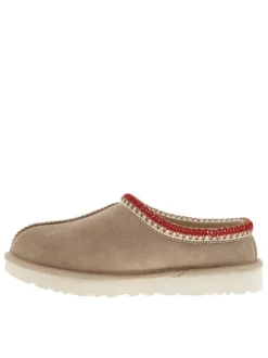 Pantoufles tasman en cuir beige avec logo iconique embossé sur le côté