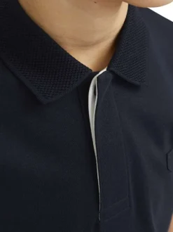 Polo marine uni à coupe droite avec col boutonné et à manches courtes