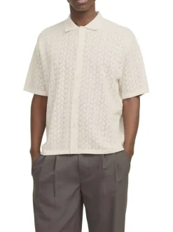 Polo beige à coupe droite pourvu d'un col à revers et de manches courtes