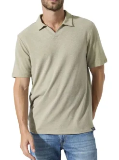 Polo beige uni avec une coupe droite et des manches courtes