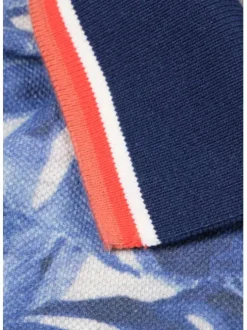 Polo blanc en coton maille piquée avec imprimé feuilles tropicales all-over coupe droite