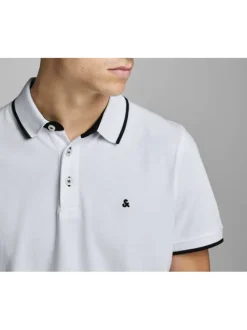 Polo blanc uni en coton avec une coupe droite avec liseré noir sur le col et les manches