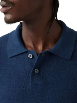 Polo bleu marine uni à coupe droite et à col fermé par deux boutons