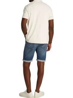 Polo écru uni en coton mélangé fermé par deux boutons avec une coupe ajustée
