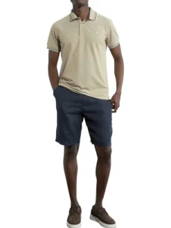 Polo en coton beige en maille piquée à coupe droite avec un col à revers