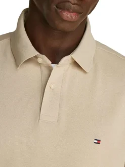 Polo en coton beige uni avec une coupe droite et un col polo