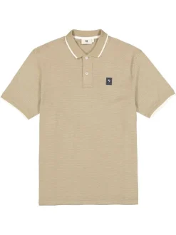 Polo en coton beige uni avec une coupe droite et un col à revers