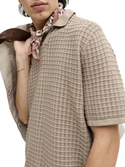 Polo en coton biologique beige à coupe droite pourvu d'un col à revers