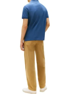 Polo en coton biologique bleu à coupe ajustée pourvu d'un col boutonné