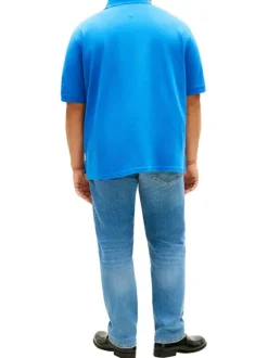 Polo en coton biologique bleu uni avec une coupe droite et un col boutonné