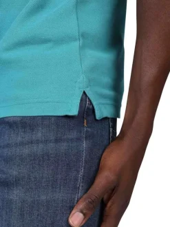 Polo en coton biologique bleu uni avec une coupe droite et un col à revers