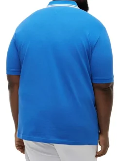 Polo en coton biologique bleu uni pourvu d'un col boutonné et de manches courtes