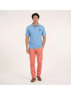 Polo en coton biologique bleu uni pourvu d'un col boutonné et d'une coupe droite