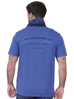 Polo en coton biologique bleu uni pourvu d'une coupe droite et d'un col boutonné