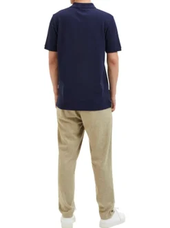 Polo en coton biologique maille piquée marine à coupe droite et col boutonné