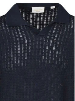 Polo en coton biologique marine uni avec une coupe droite et un col revers