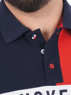 Polo en coton biologique marine uni pourvu d'un col boutonné