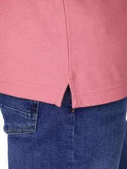 Polo en coton biologique rose uni avec une coupe droite et un col boutonné