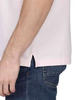 Polo en coton biologique rose uni avec une coupe droite et un col à revers