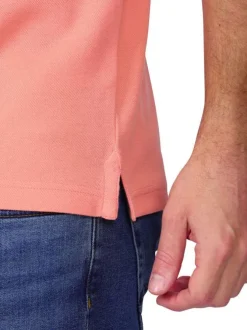 Polo en coton biologique rose uni avec une coupe droite et un col à revers