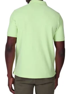 Polo en coton biologique vert uni avec une coupe droite et un col boutonné