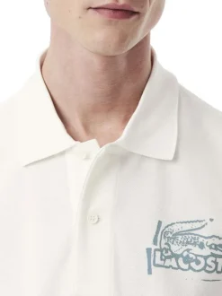 Polo en coton blanc avec un motif une coupe droite et un col à revers