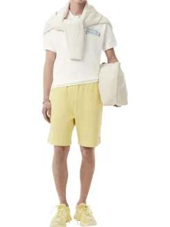Polo en coton blanc avec un motif une coupe droite et un col à revers