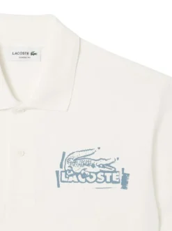 Polo en coton blanc avec un motif une coupe droite et un col à revers