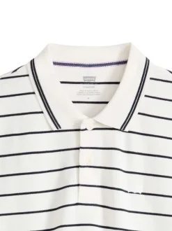 Polo en coton blanc à rayures avec une coupe droite et un col boutonné