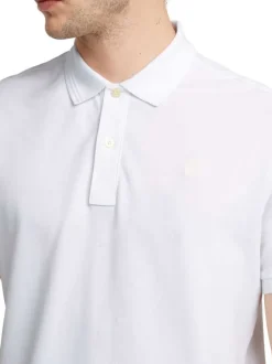 Polo en coton blanc uni avec une coupe droite et un col boutonné