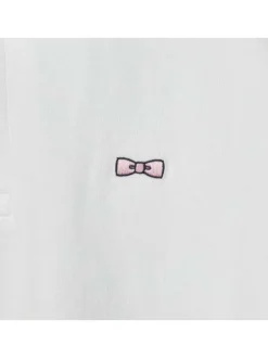 Polo en coton blanc uni coupe droite avec un col boutonné et logo