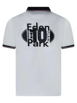 Polo en coton blanc uni pourvu d'un col boutonné et d'une coupe droite