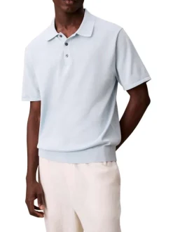 Polo en coton bleu ciel uni à coupe légèrement oversize avec le logo brodé