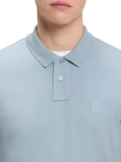 Polo en coton bleu à coupe droite pourvu d'un col côtelé boutonné