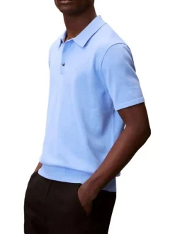 Polo en coton bleu à coupe droite pourvu d'un col à revers boutonné