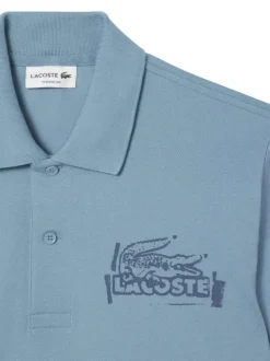 Polo en coton bleu en maille piquée avec une coupe droite et un col à revers