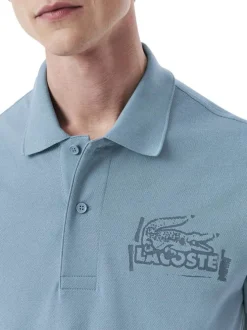 Polo en coton bleu en maille piquée avec une coupe droite et un col à revers