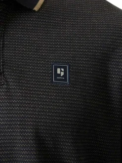 Polo en coton bleu marine uni avec une coupe droite et un col à revers