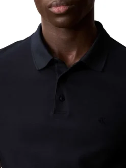 Polo en coton bleu marine uni à coupe regular fit avec le mini logo brodé