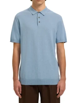 Polo en coton bleu uni avec une coupe droite et un col boutonné