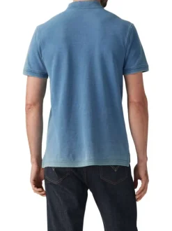 Polo en coton bleu uni avec une coupe droite et un col fermé par trois boutons