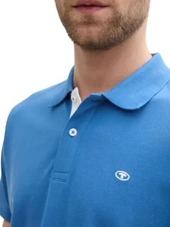 Polo en coton bleu uni à coupe regular fit avec un col à revers et le logo brodé