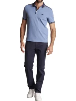 Polo en coton bleu uni à coupe slim avec un col à revers fermé par des pressions