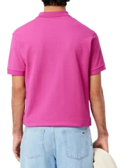 Polo en coton fuchsia uni avec une coupe regular fit et le petit crocodile brodé