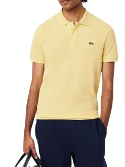 Polo en coton jaune chiné avec une coupe slim fit et le petit crocodile brodé